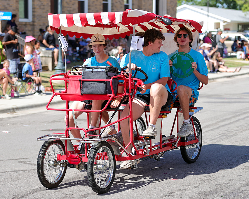 The Cherry on Top storefront during a community event in downtown Lampasas, Texas