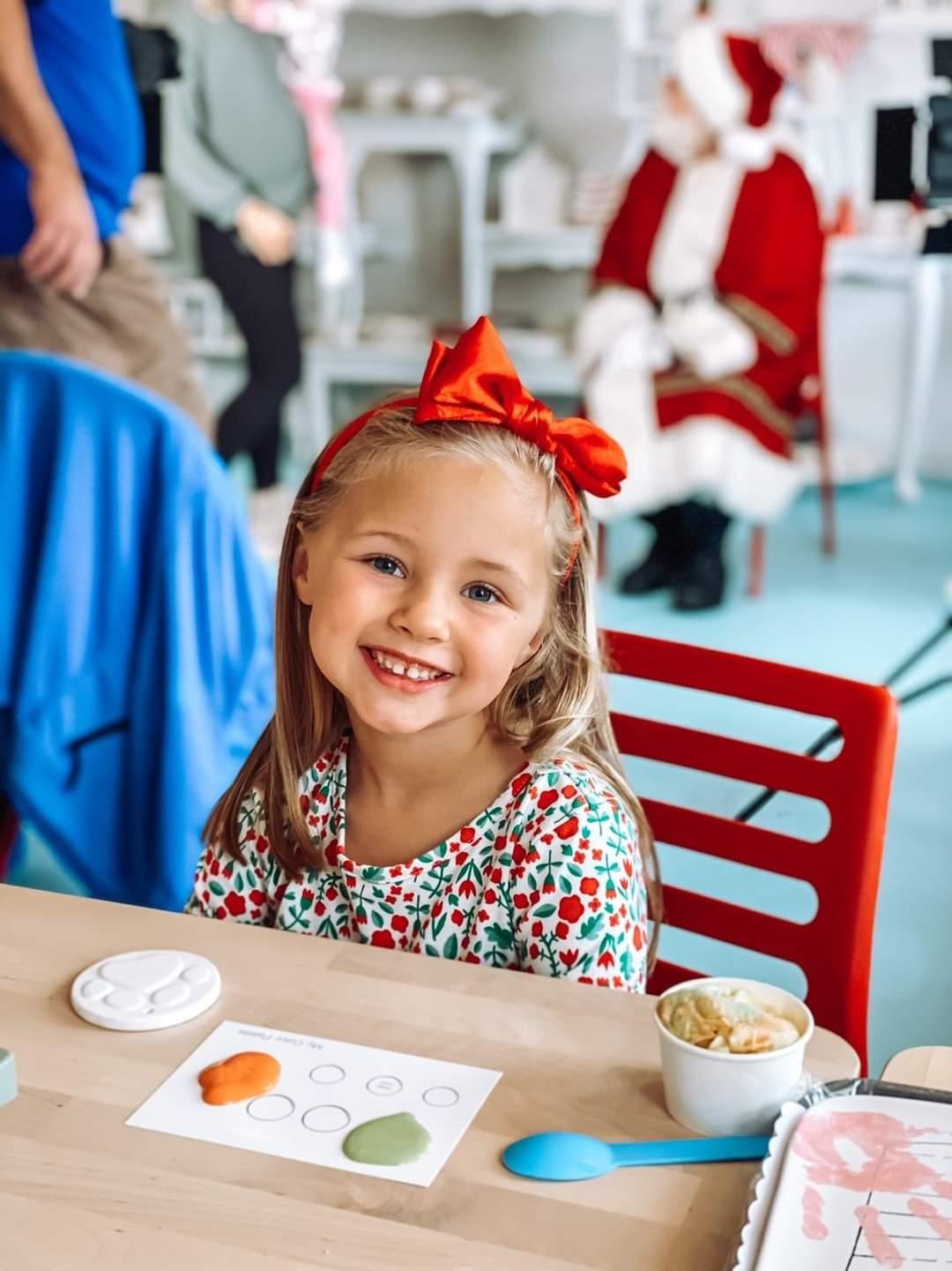 A child enjoying a seasonal creative event at The Cherry on Top